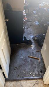 fire damaged bedroom floors covered in debris