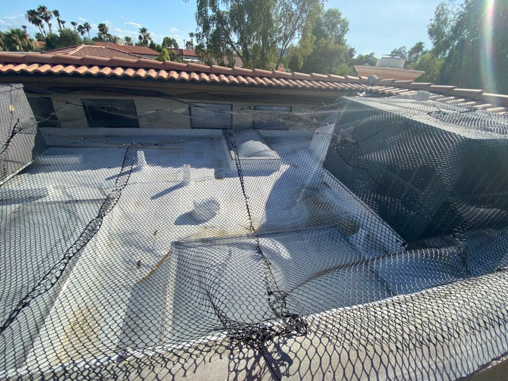 a foam sprayed roof covered in netting